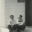 8. Man Ray and Marcel Duchamp Seated on a Curb, Hollywood, 1949, gelatin silver print.  Francis M. Naumann Fine Art, New York.   